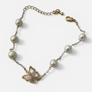 Gold Tone Mother of Pearl Butterfly Bracelet (7” + 2” extender).